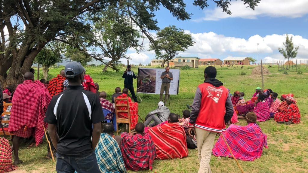 Community outdoor gathering promoting sustainable development and environmental conservation.