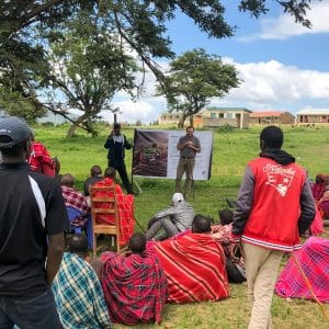 Community outdoor gathering promoting sustainable development and environmental conservation.